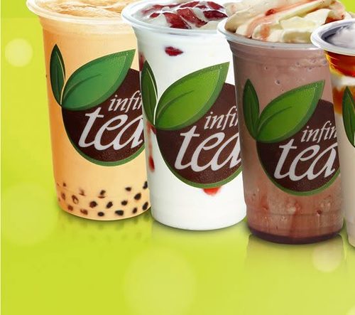 Assorted Infinitea milk teas and frappes with whipped cream and toppings